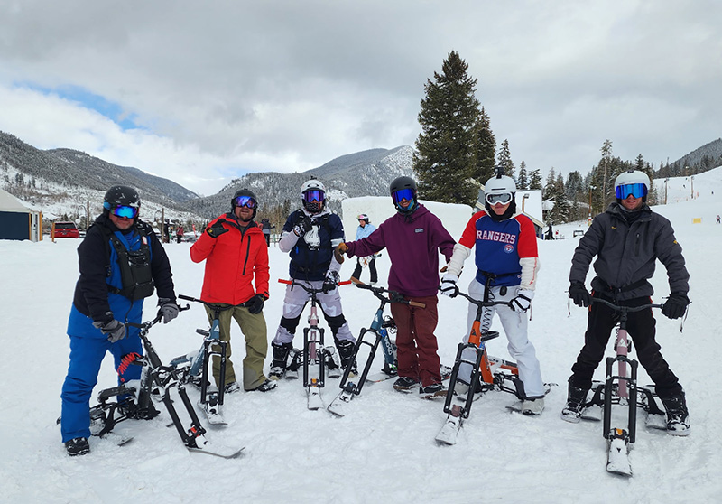 Group of customers at the top of the mountain on their SNO-GOs